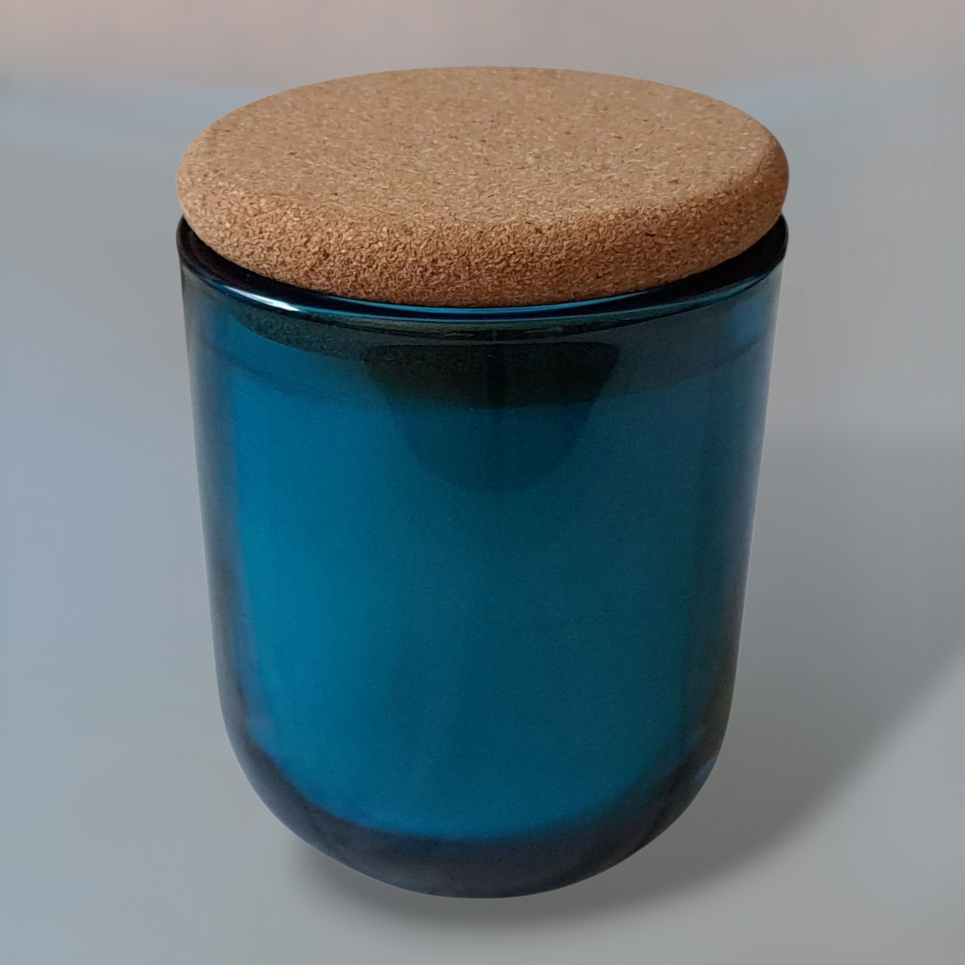 Saltmere luxury soy candle in blue glass jar with cork lid close-up