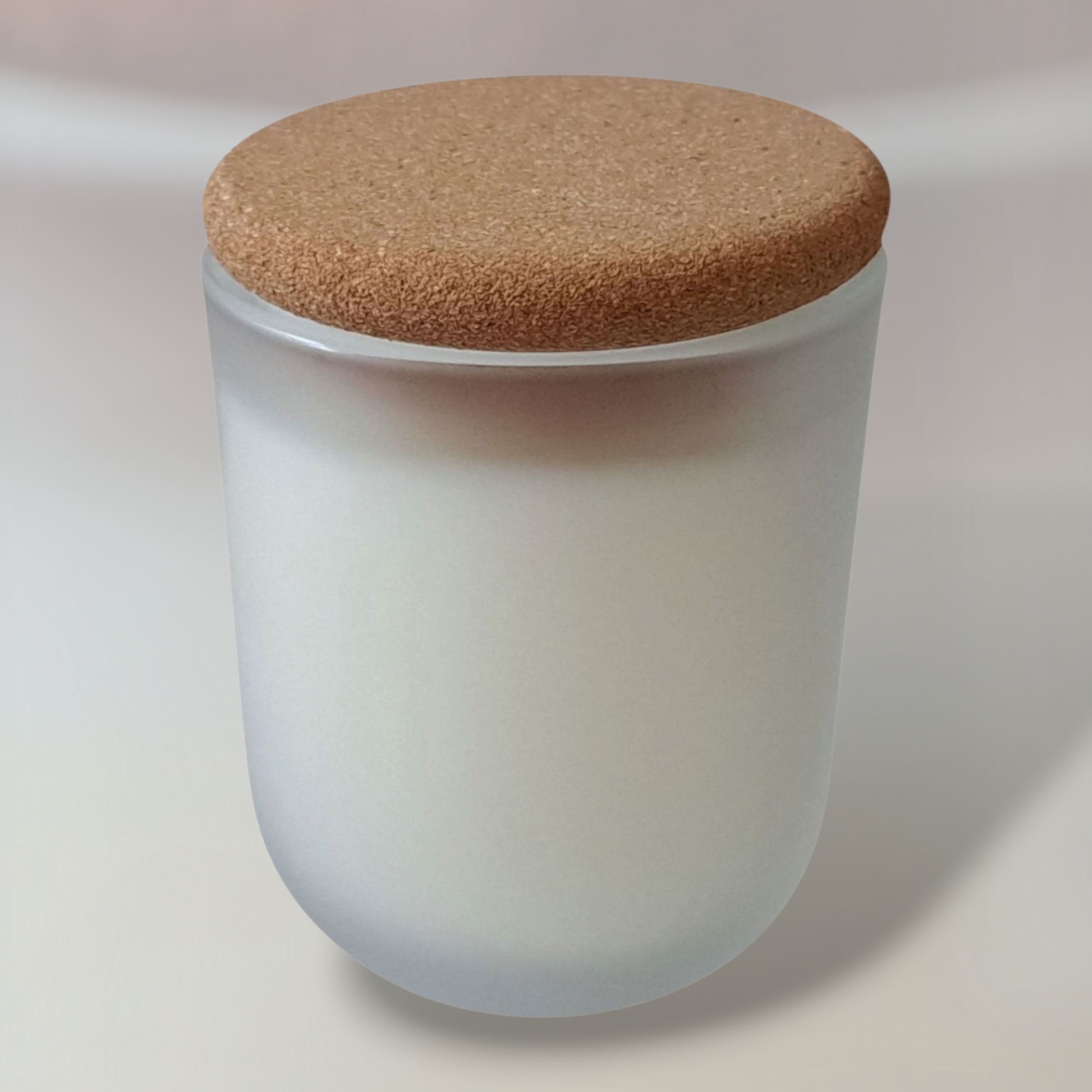 Frosted glass Orriswood candle with cork lid and pale background