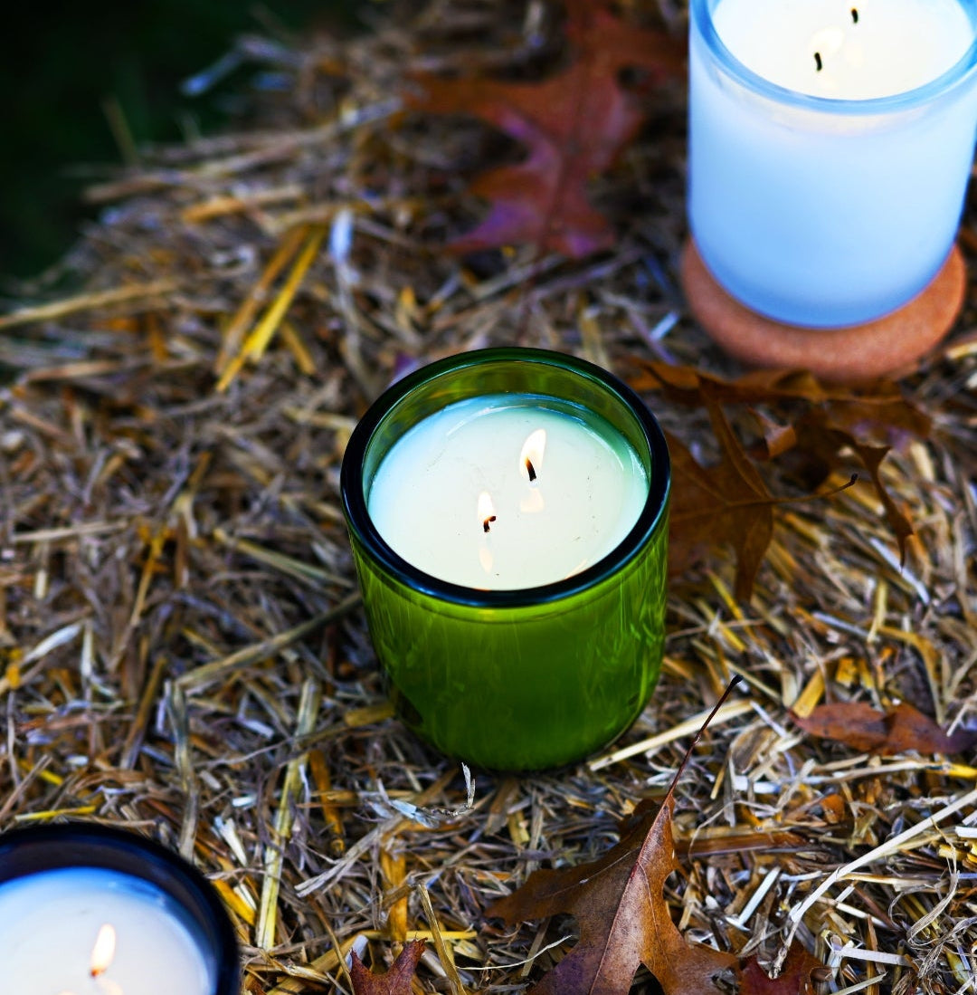 candles on hay with leaves and natural background